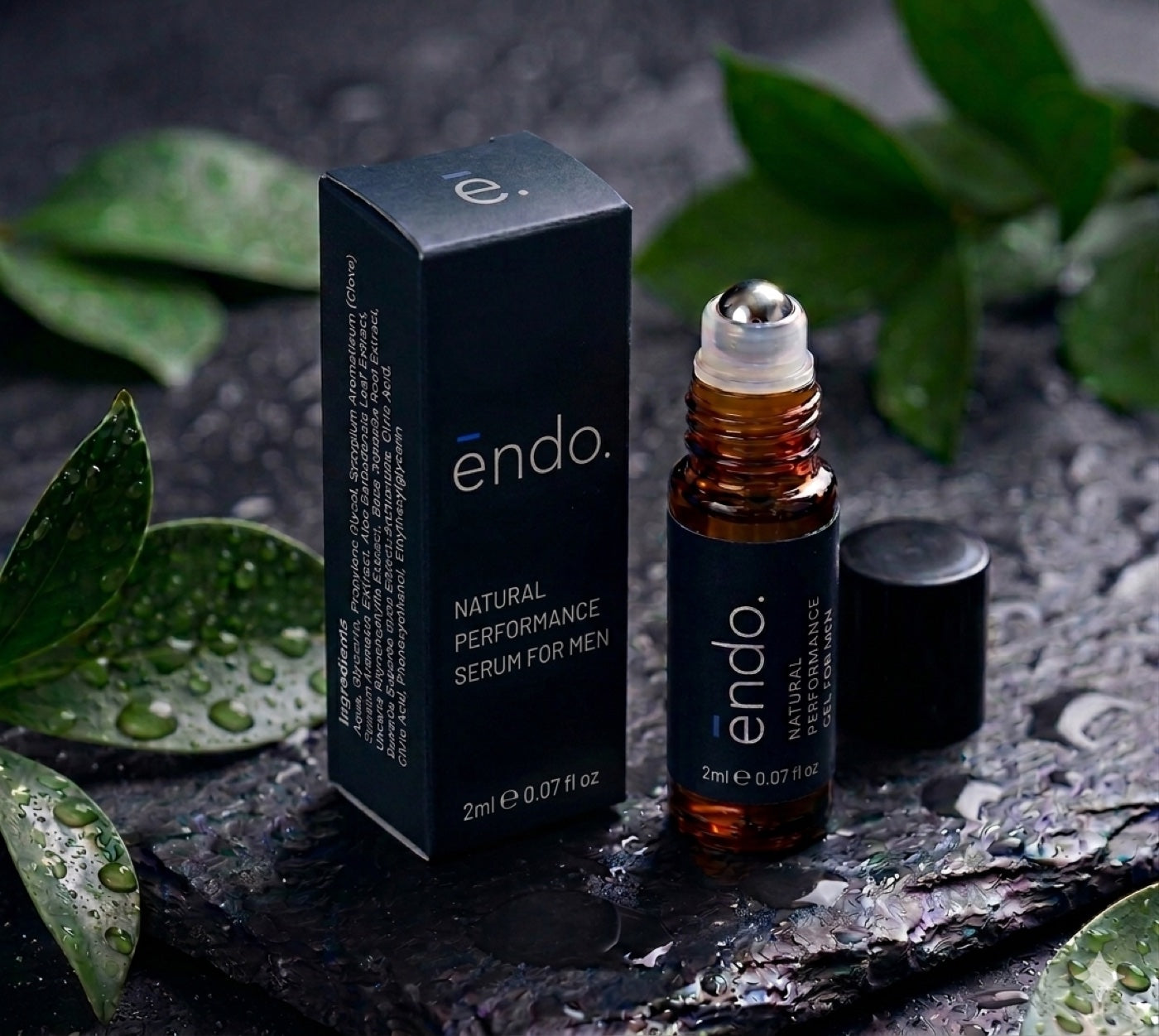 Endo serum bottle, cap, and packaging on wet stone with botanical leaves